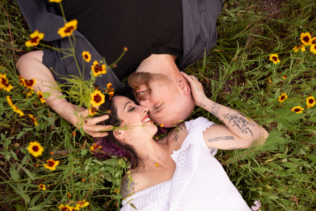 birds eye view of engaged couple in flower field