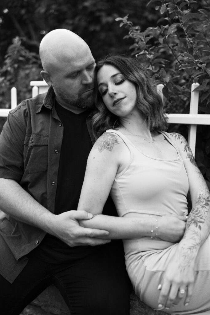 moody editorial shot of engaged couple in black and white